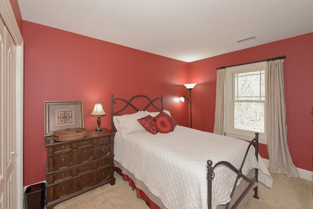 125 Brookside Drive Uxbridge, MA 01569 - Photo 29 of 40 a bedroom with a bed and a dresser