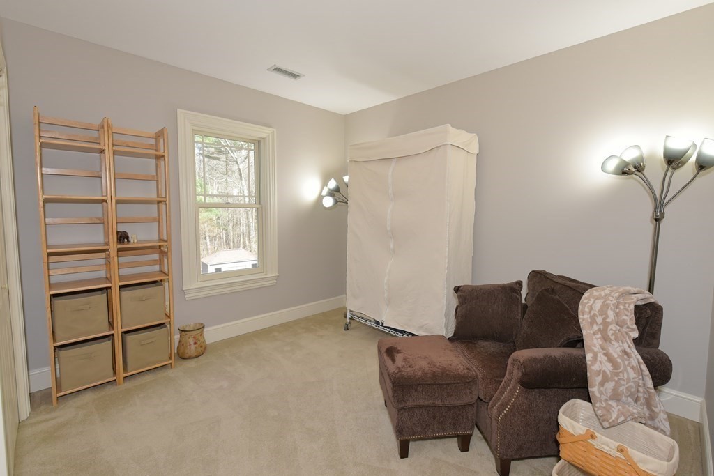 125 Brookside Drive Uxbridge, MA 01569 - Photo 30 of 40 a living room with furniture and a window