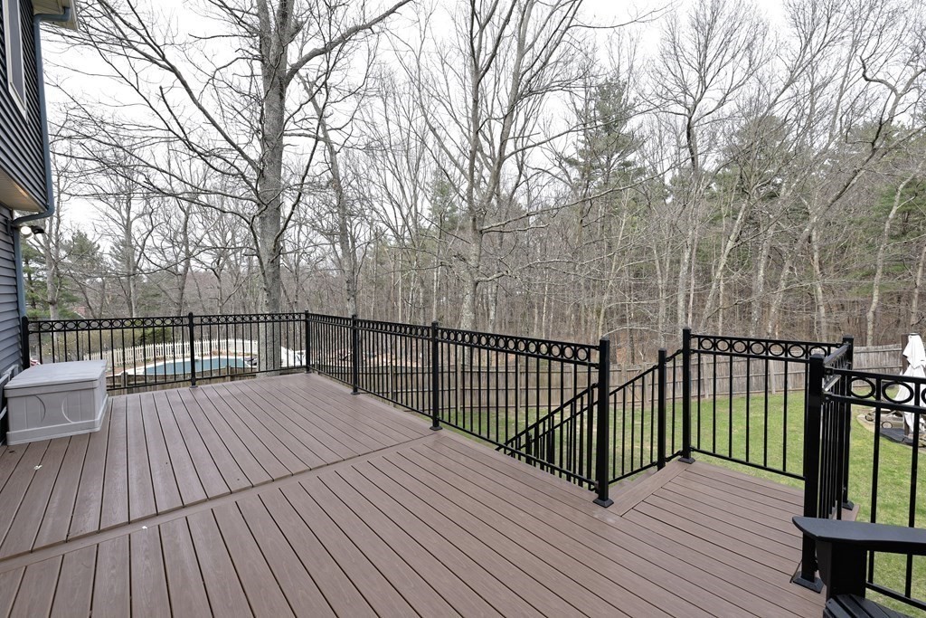 125 Brookside Drive Uxbridge, MA 01569 - Photo 39 of 40 a view of deck with wooden floor and fence