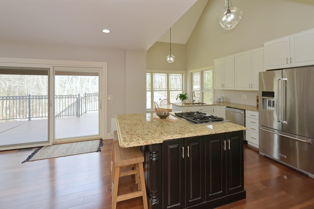 125 Brookside Drive Uxbridge, MA 01569 - Photo 9 of 40 a kitchen with stainless steel appliances granite countertop a sink stove and refrigerator