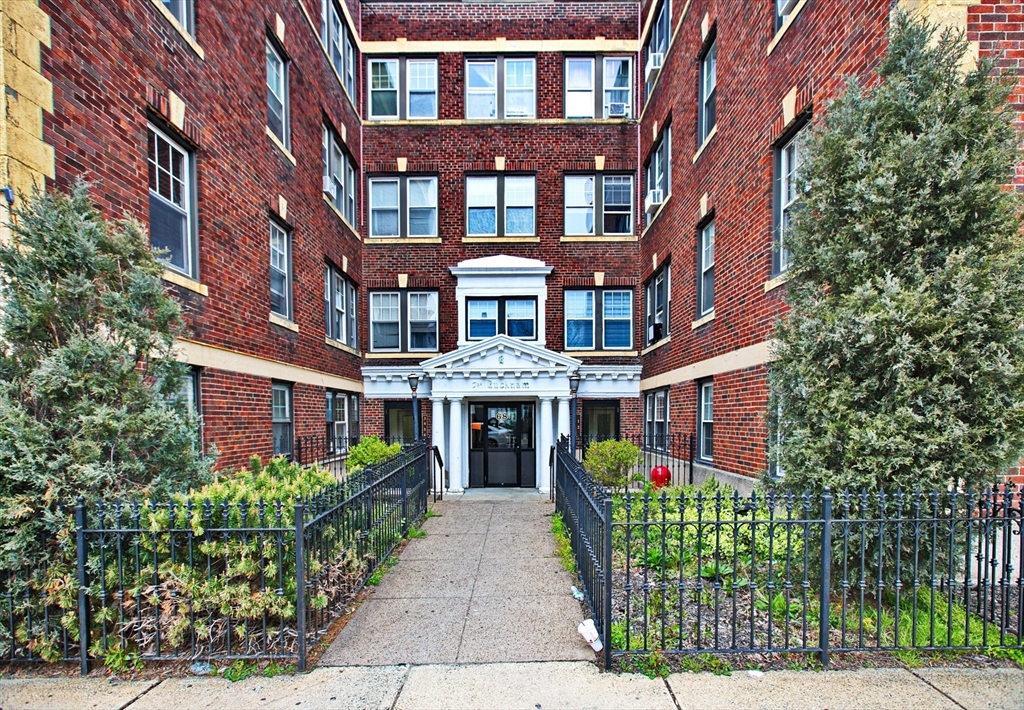 68 Linden Street, Unit 27 Everett, MA 02149 - Photo 1 of 13 a front view of a multi story residential apartment building
