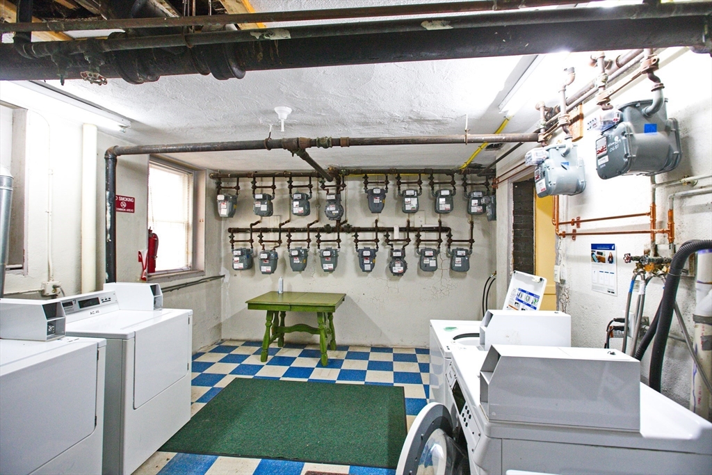 68 Linden Street, Unit 27 Everett, MA 02149 - Photo 13 of 13 a living room filled with furniture and a table