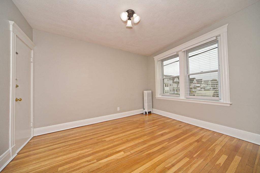 68 Linden Street, Unit 27 Everett, MA 02149 - Photo 5 of 13 a view of an empty room with a window