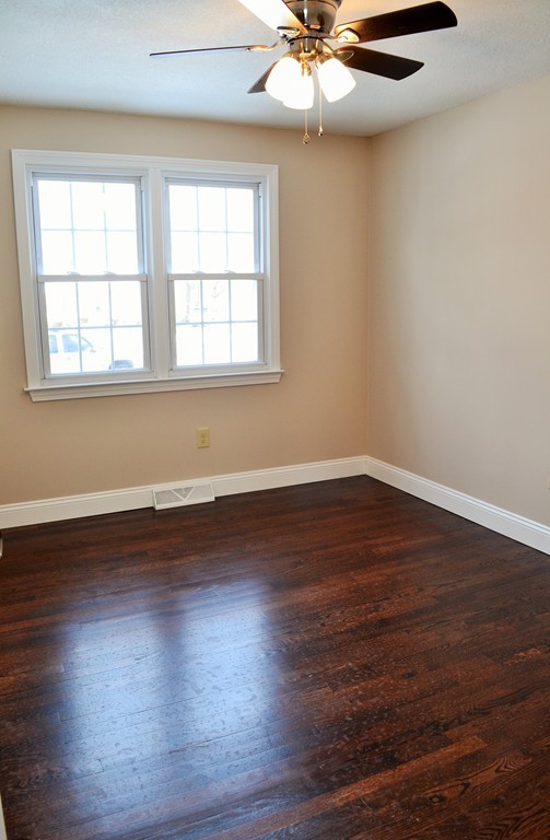 29 East Hill Road Springfield, MA 01109 - Photo 11 of 19 a view of a room with wooden floor and windows
