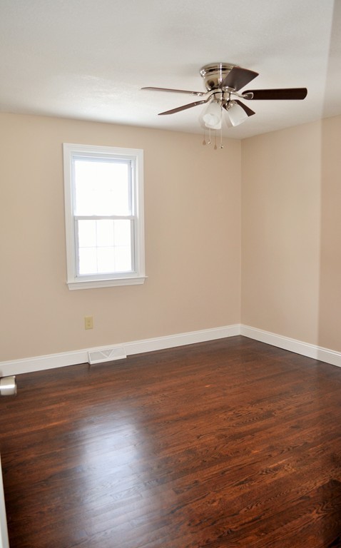 29 East Hill Road Springfield, MA 01109 - Photo 12 of 19 a view of a room with wooden floor closet and windows
