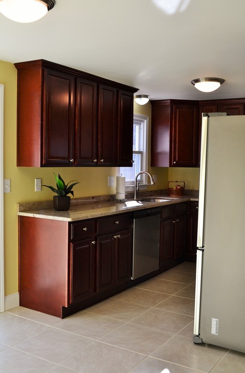 29 East Hill Road Springfield, MA 01109 - Photo 5 of 19 a kitchen with granite countertop cabinets and window