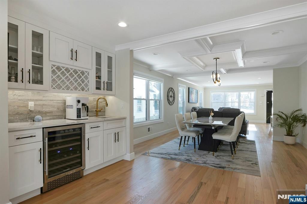 676 Ridgewood Avenue Oradell, NJ 07649 - Photo 13 of 47 a view of a dining room with furniture and wooden floor