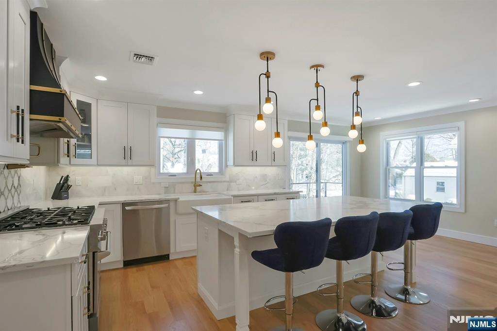 676 Ridgewood Avenue Oradell, NJ 07649 - Photo 17 of 47 a kitchen with cabinets table and chairs