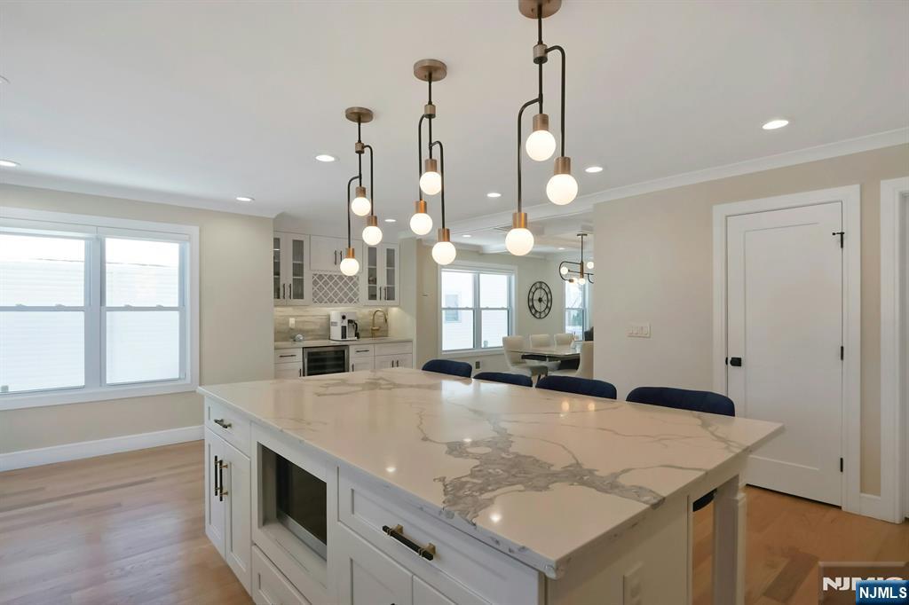 676 Ridgewood Avenue Oradell, NJ 07649 - Photo 20 of 47 a kitchen with a stove a sink and a refrigerator