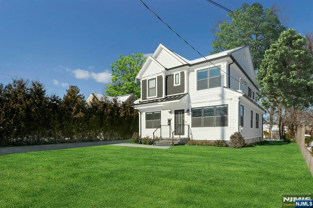 676 Ridgewood Avenue Oradell, NJ 07649 - Photo 2 of 47 a front view of house with yard and green space