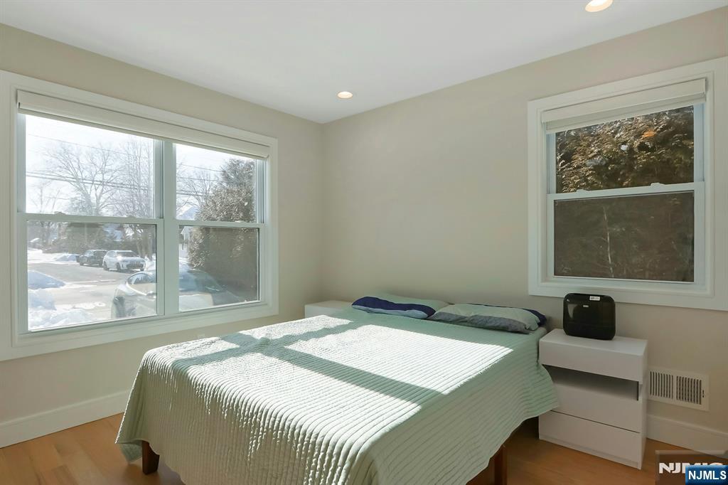 676 Ridgewood Avenue Oradell, NJ 07649 - Photo 23 of 47 a bedroom with a bed and a window