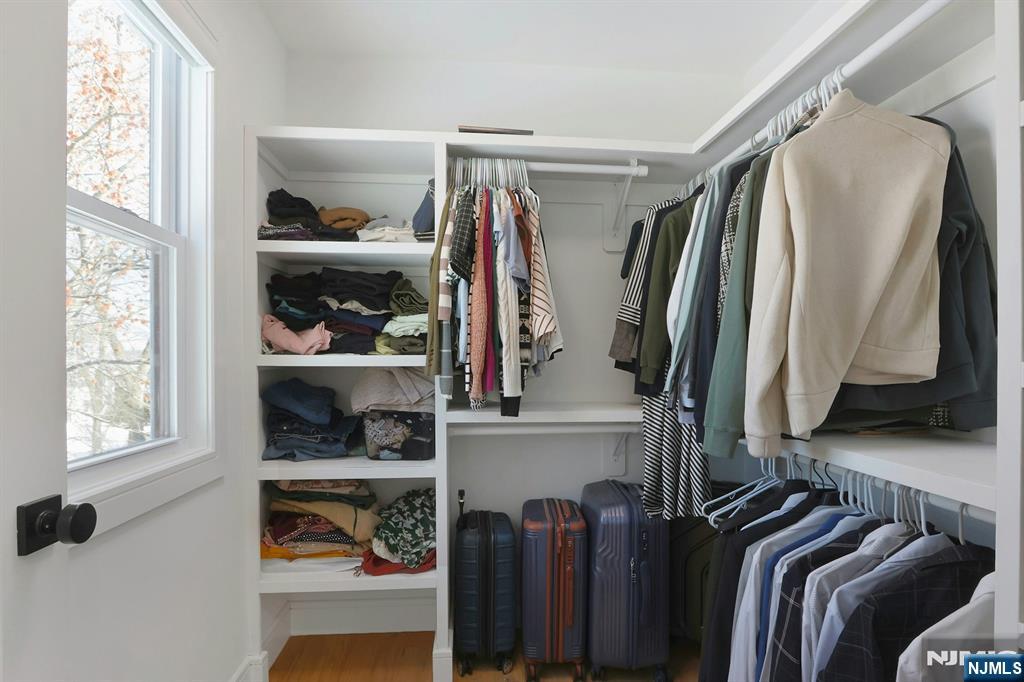 676 Ridgewood Avenue Oradell, NJ 07649 - Photo 30 of 47 a view of walk in closet with clothes and shoes