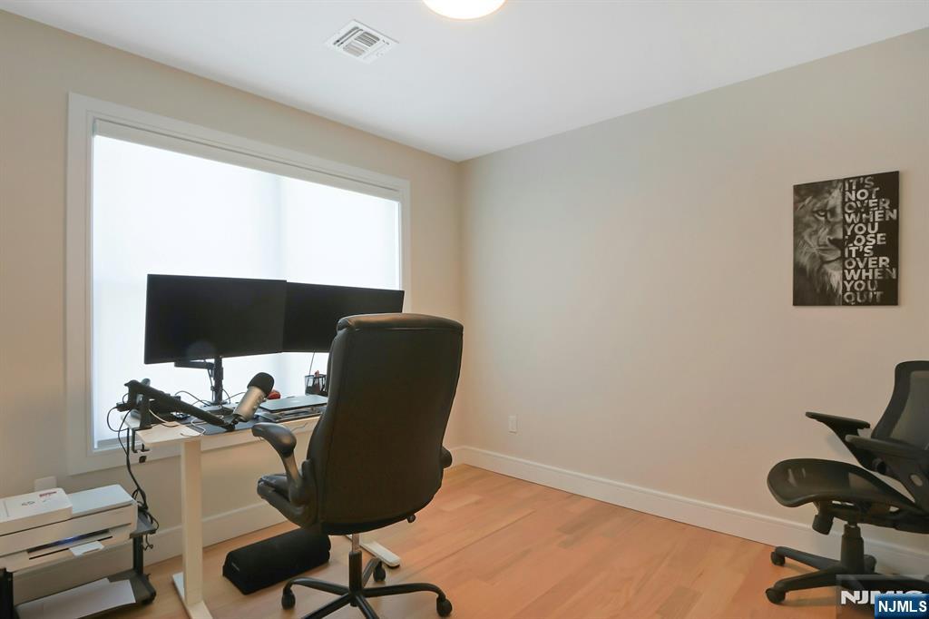 676 Ridgewood Avenue Oradell, NJ 07649 - Photo 32 of 47 a view of a workspace with furniture and a window