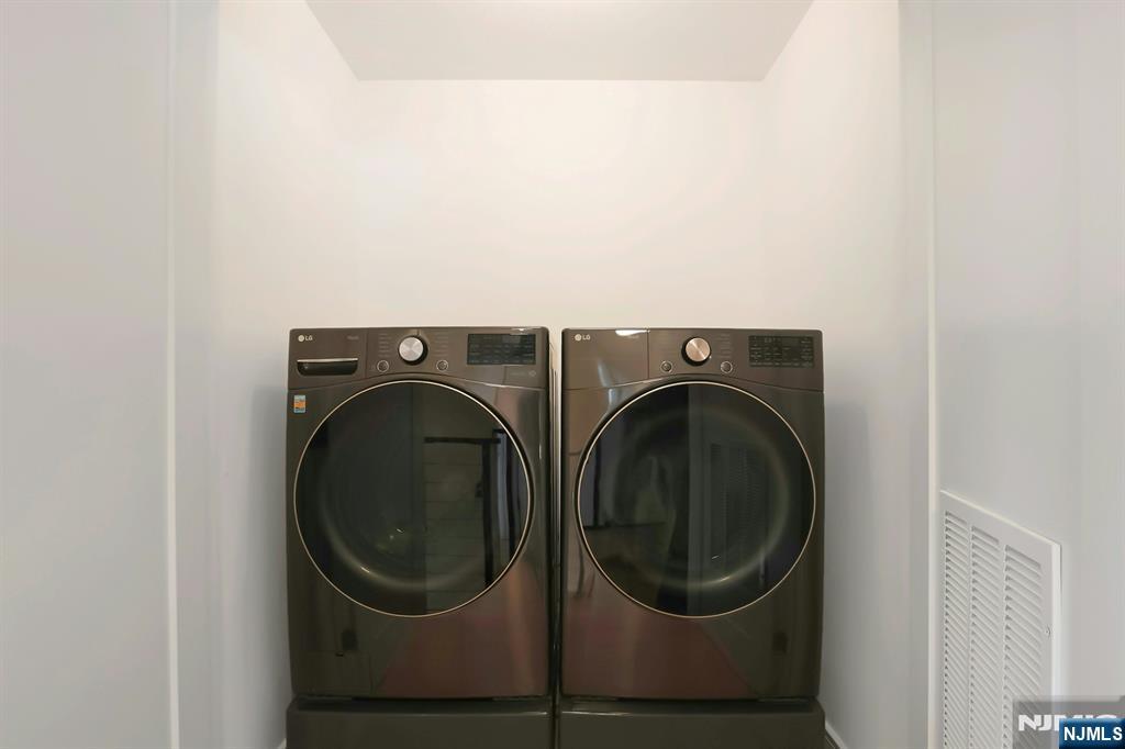 676 Ridgewood Avenue Oradell, NJ 07649 - Photo 36 of 47 a utility room with dryer and washer