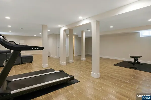 a large room with lots of furniture and a chandelier