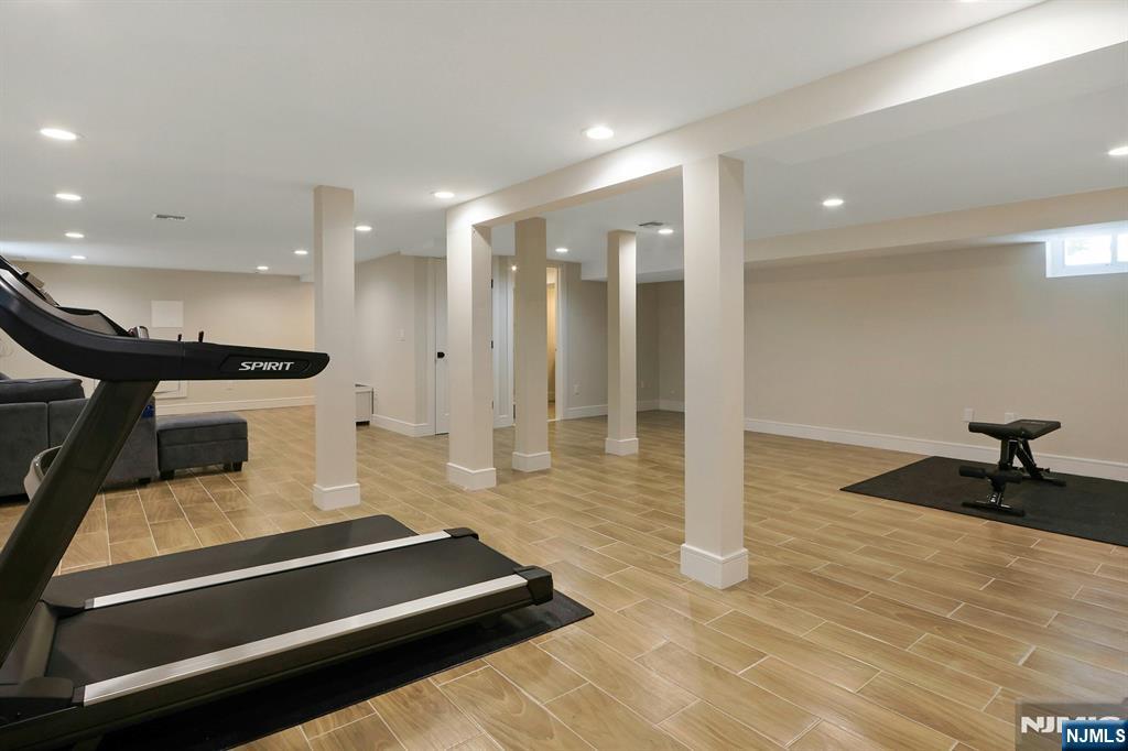 676 Ridgewood Avenue Oradell, NJ 07649 - Photo 41 of 47 a large room with lots of furniture and a chandelier