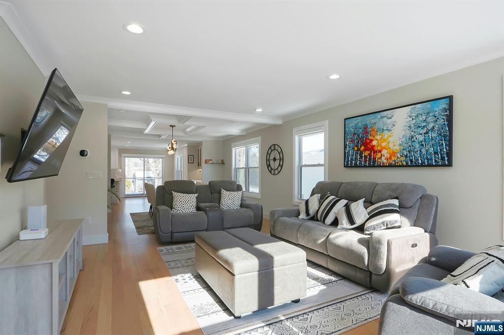 676 Ridgewood Avenue Oradell, NJ 07649 - Photo 5 of 47 a living room with furniture and a flat screen tv