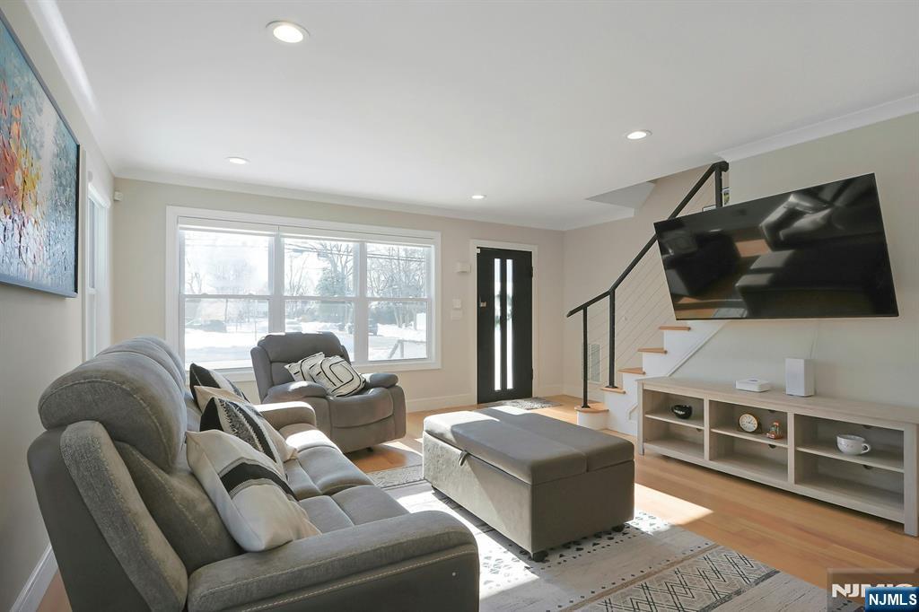 676 Ridgewood Avenue Oradell, NJ 07649 - Photo 7 of 47 a living room with furniture and a flat screen tv