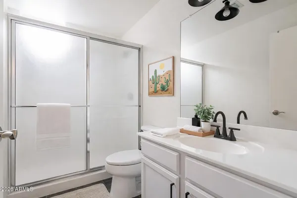 a bed room with a bed and a night lamp