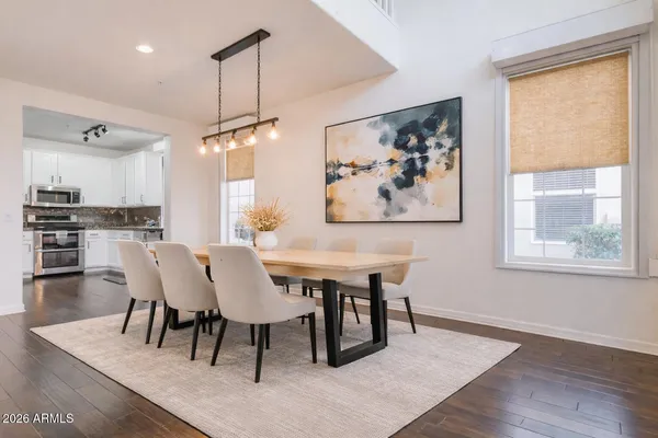 a view of a dining room with furniture window and wooden floor