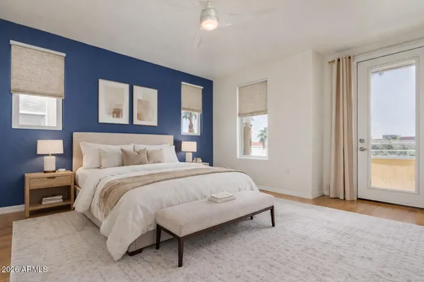a bedroom with a bed and window
