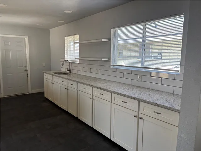 a bathroom with a sink and a window