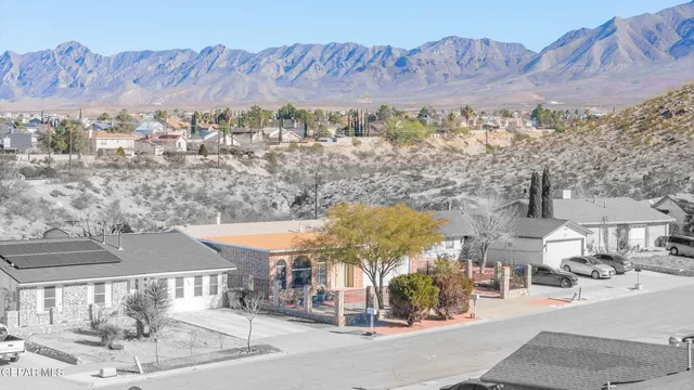 a bed room with a bed and a chandelier