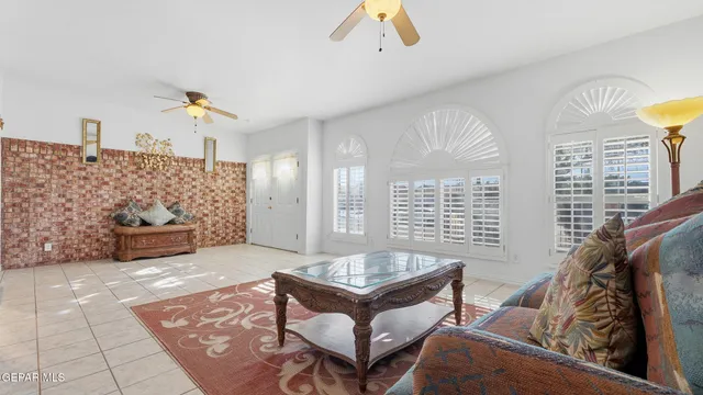 an aerial view of house with yard and mountain view in back