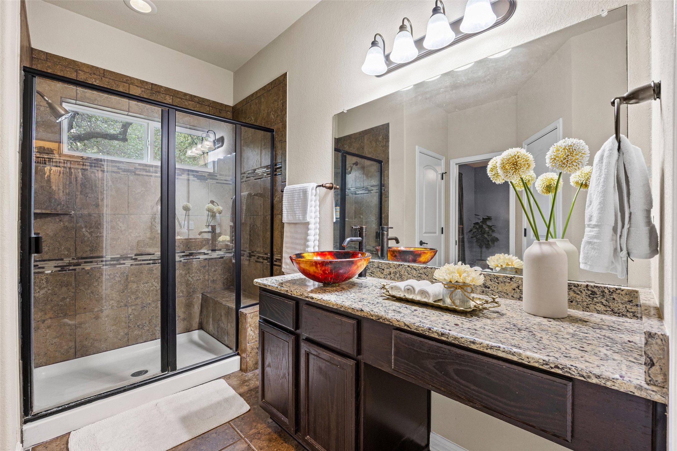 3451 Mayfield Ranch Boulevard, Unit 201 Round Rock, TX 78681 - Photo 18 of 29 a bathroom with a granite countertop sink and a mirror