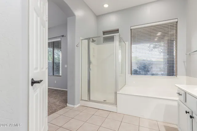 a bathroom with a bathtub and shower