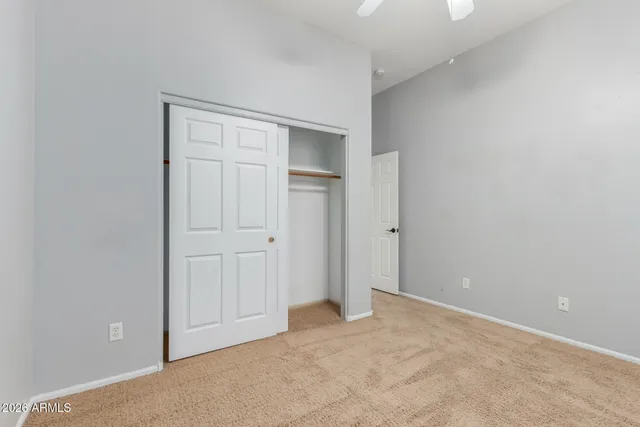 an empty room with closet area