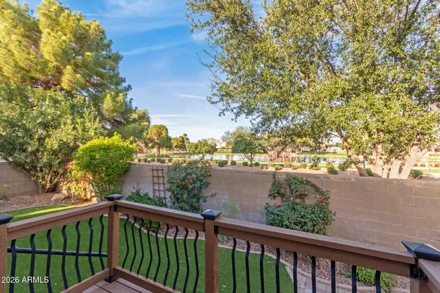 a view of a balcony with wooden fence