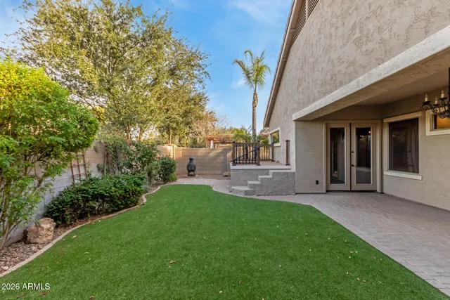 a view of backyard with a garden and plants