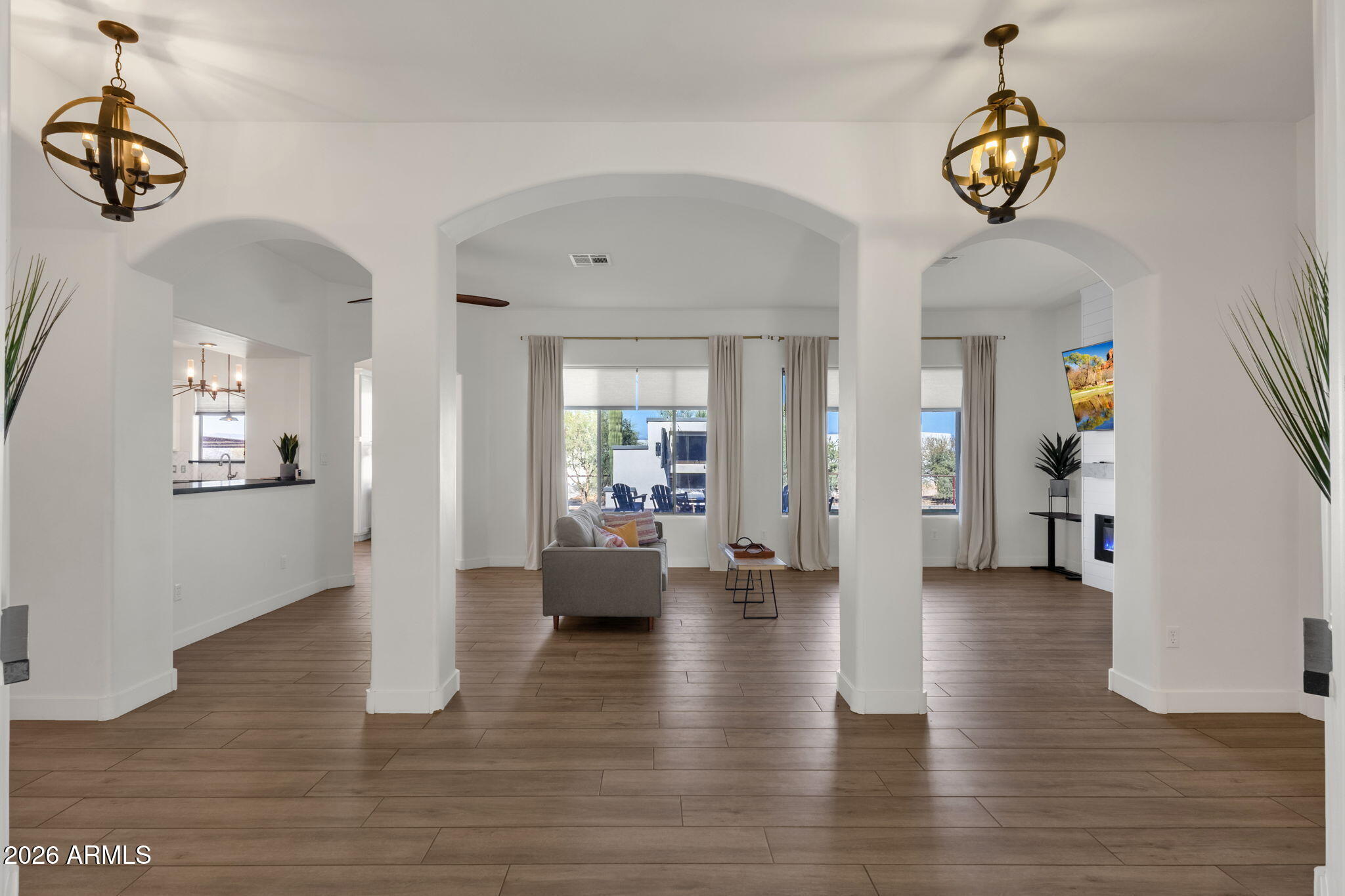 14604 East Peak View Road Scottsdale, AZ 85262 - Photo 6 of 55 a living room with couches and a chandelier