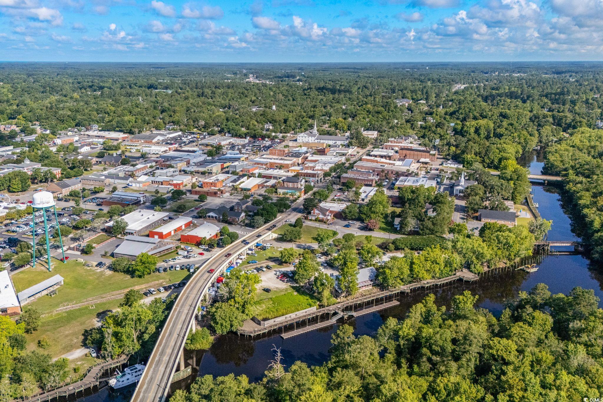 4765 Cates Bay Highway Conway, SC 29527 - Photo 20 of 32 Aerial view of property's location with a notable bridge and a heavily wooded area