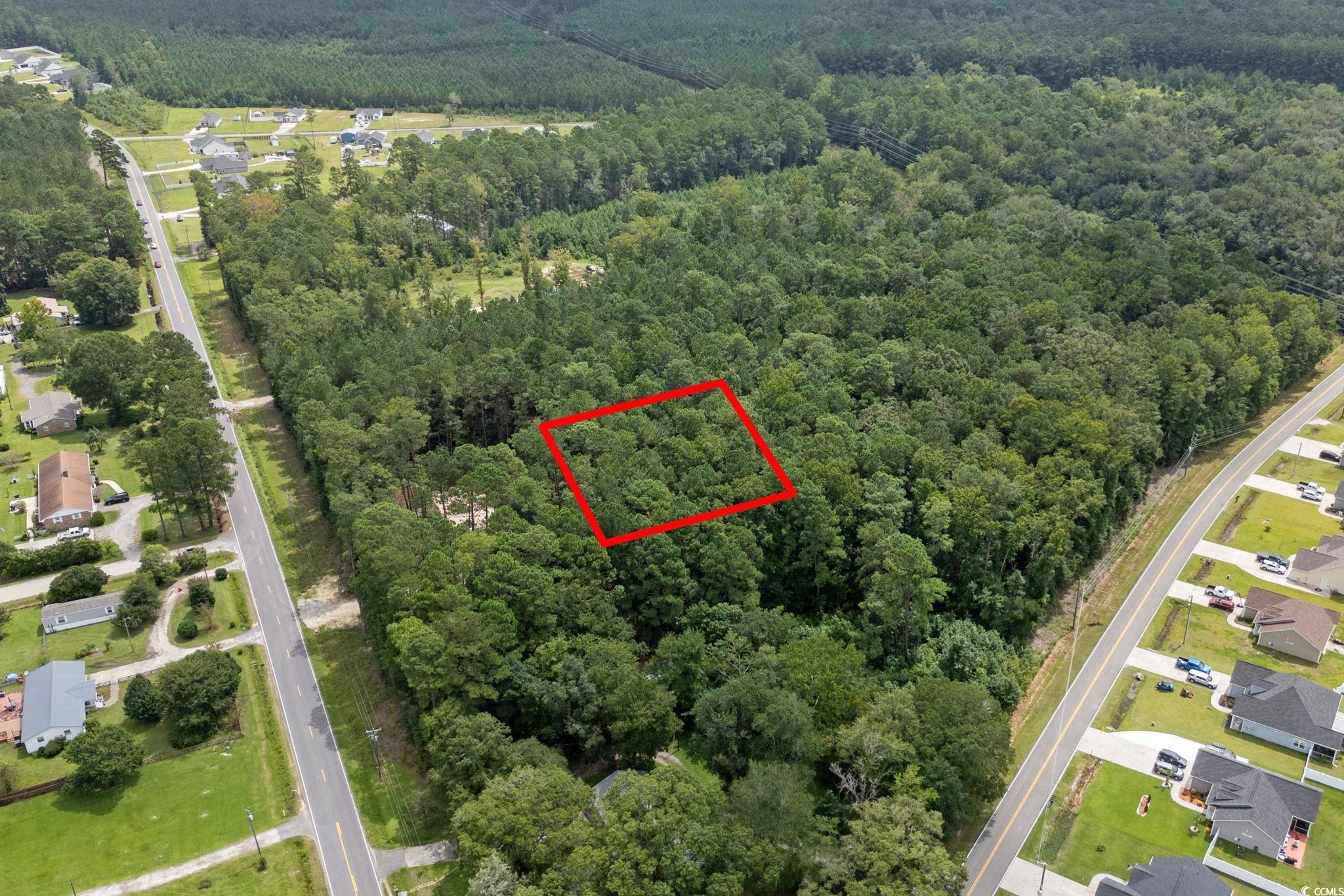 4765 Cates Bay Highway Conway, SC 29527 - Photo 8 of 32 Aerial view of residential area featuring a heavily wooded area and property parcel outlined