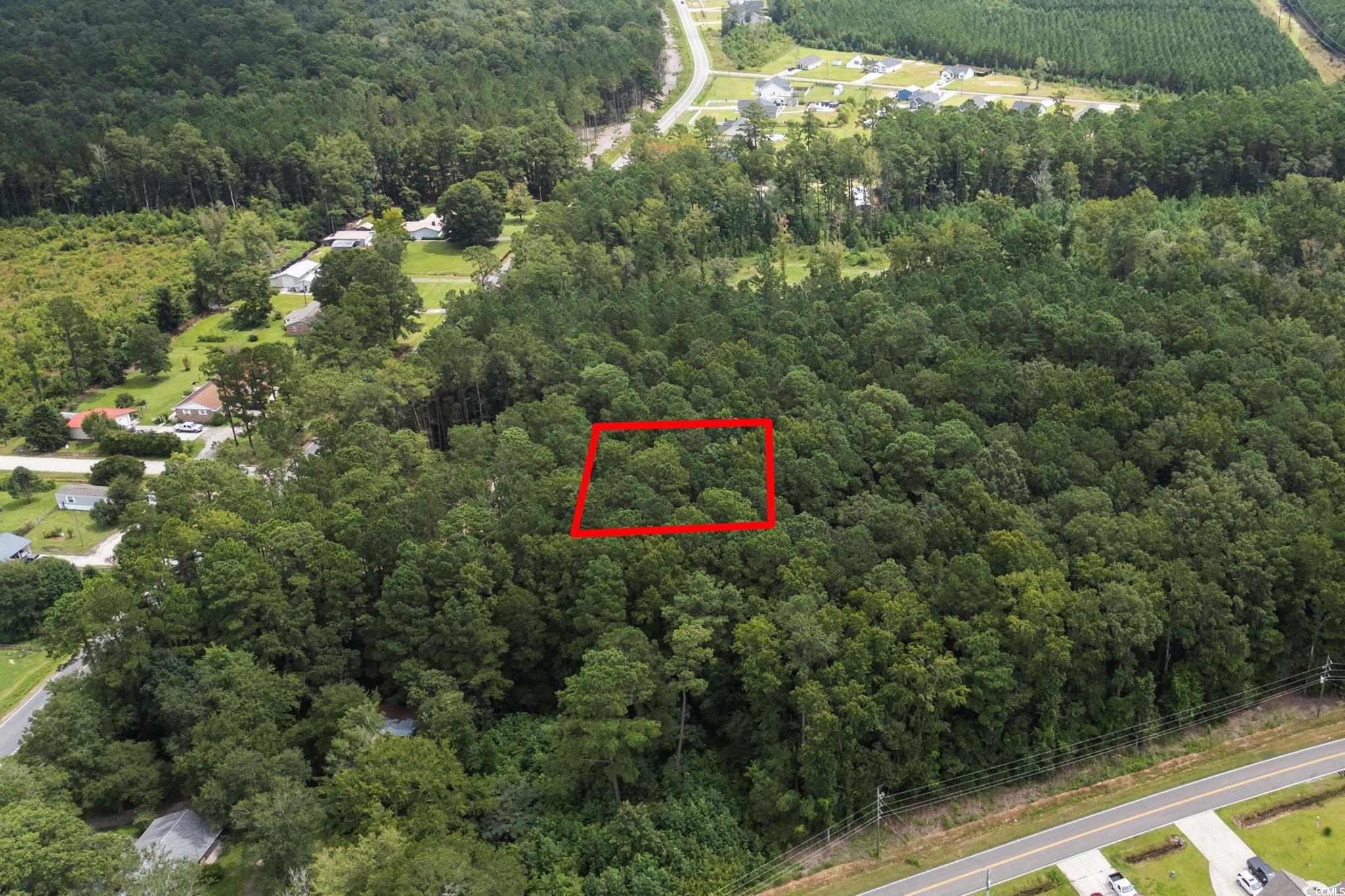 4765 Cates Bay Highway Conway, SC 29527 - Photo 10 of 32 Aerial view of sparsely populated area with a heavily wooded area and property parcel outlined