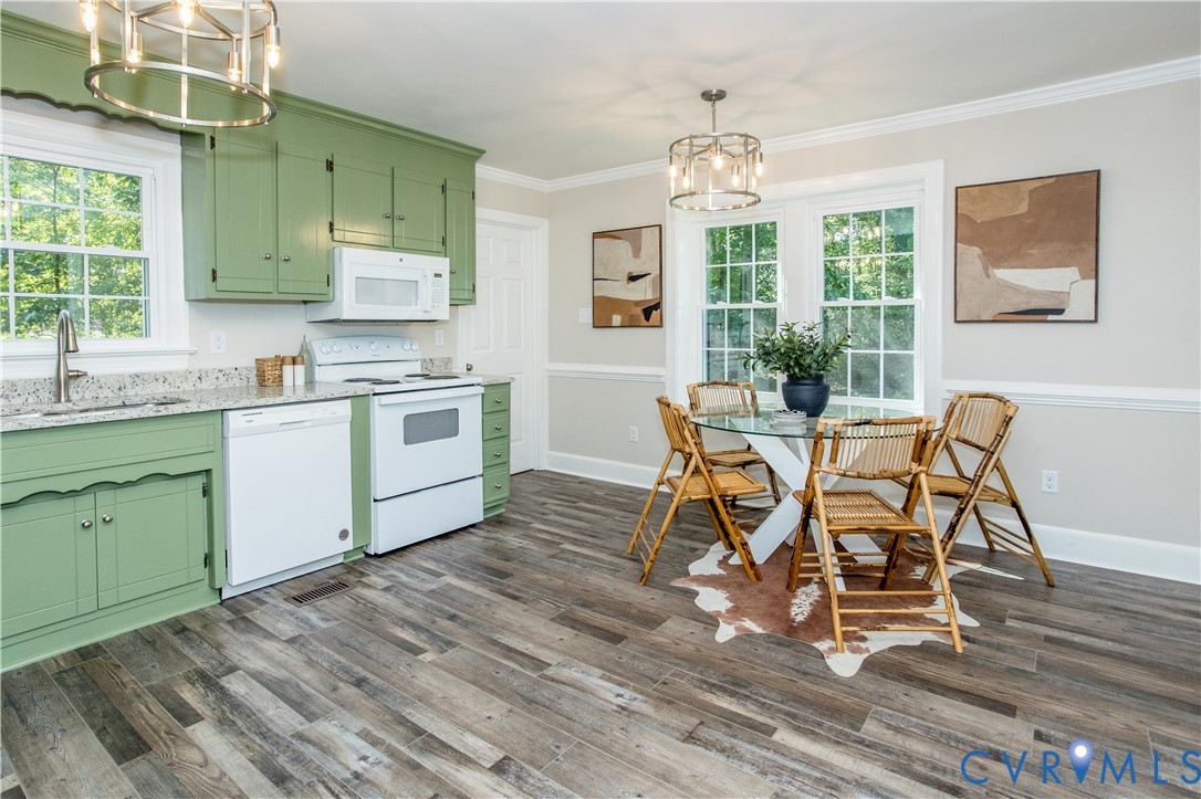 13110 Hensley Road Midlothian, VA 23112 - Photo 5 of 24 a dining room with wooden floor a sink a glass table and chairs