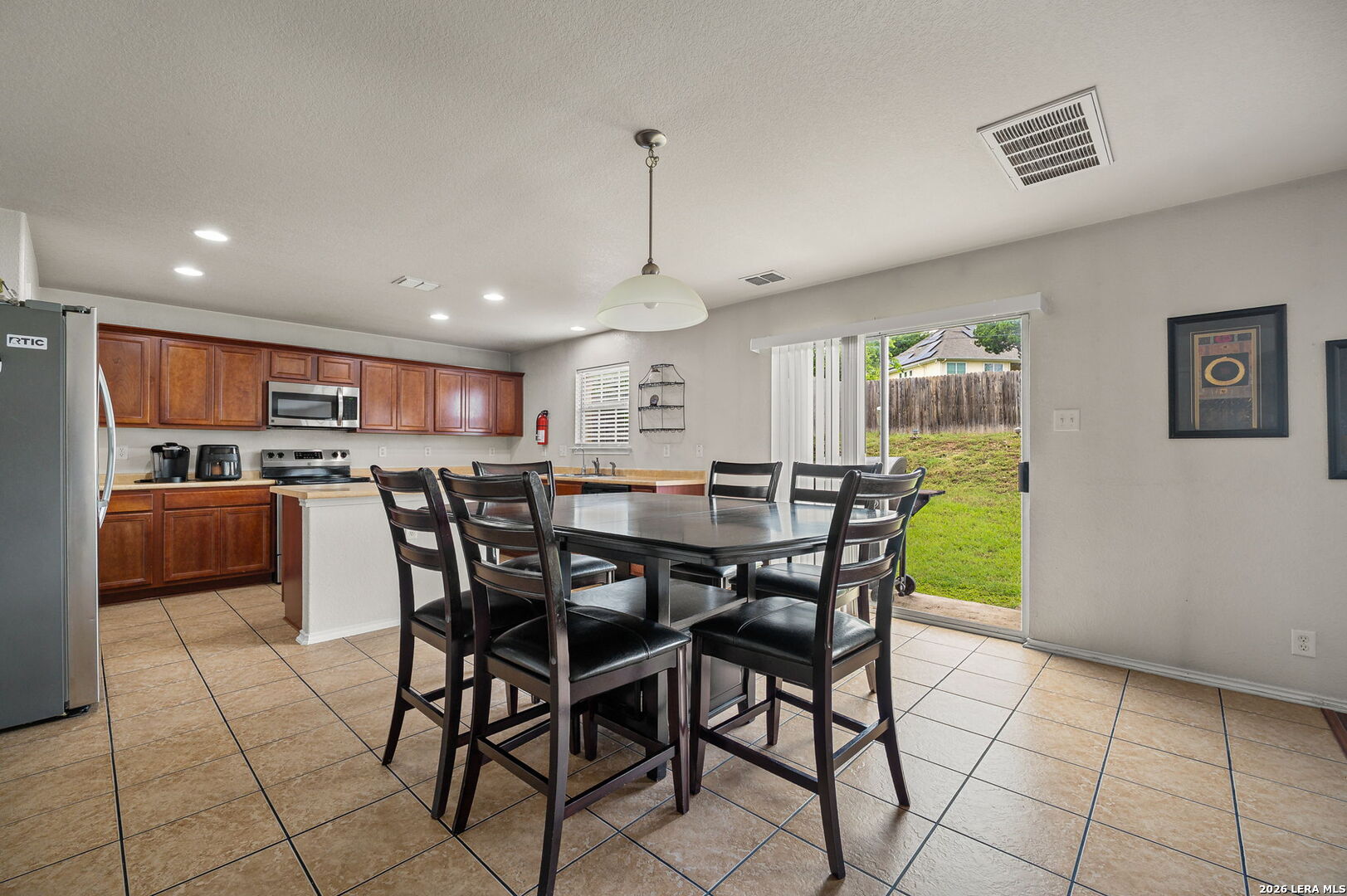 7207 Avery Road Live Oak, TX 78233 - Photo 14 of 32 a view of a dining room with furniture