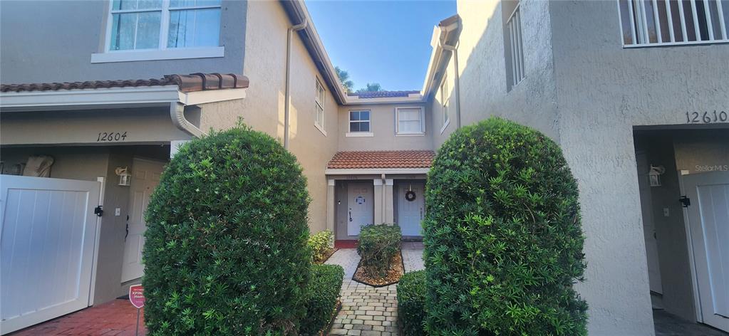 a house view with a garden space