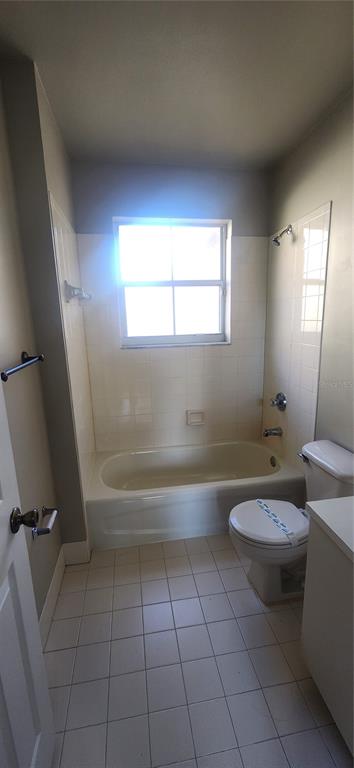 12606 Southwest 53rd Street Miramar, FL 33027 - Photo 11 of 13 a bathroom with a toilet a sink and bathtub