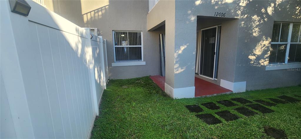 12606 Southwest 53rd Street Miramar, FL 33027 - Photo 12 of 13 a front view of a house with a yard