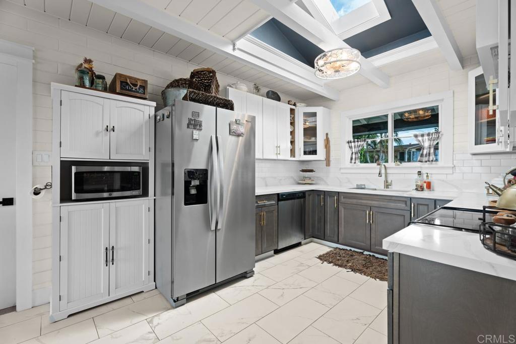 812 Sharon Way El Cajon, CA 92020 - Photo 15 of 65 a kitchen with stainless steel appliances a refrigerator a sink a stove and microwave