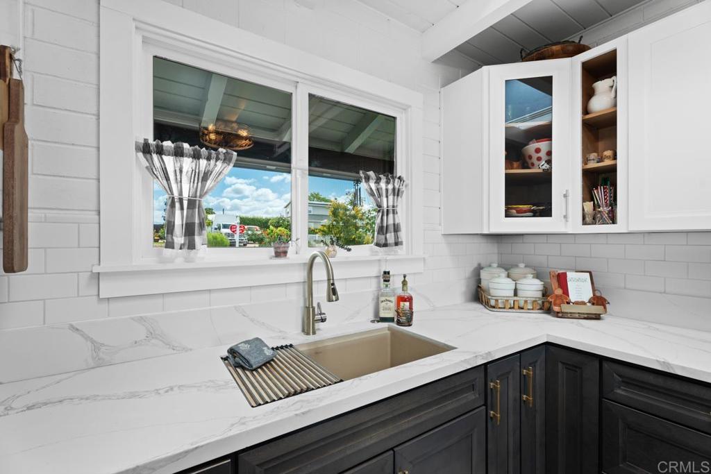 812 Sharon Way El Cajon, CA 92020 - Photo 18 of 65 a kitchen with a sink and a window