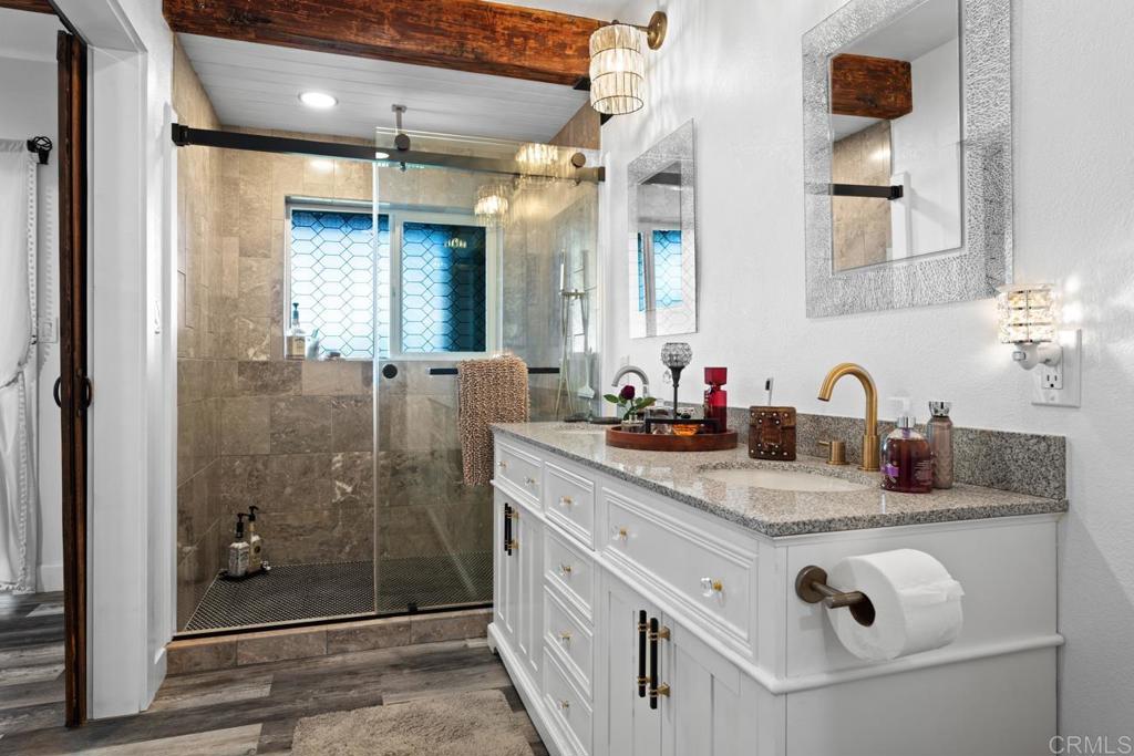 812 Sharon Way El Cajon, CA 92020 - Photo 25 of 65 a bathroom with double vanity sink and mirror
