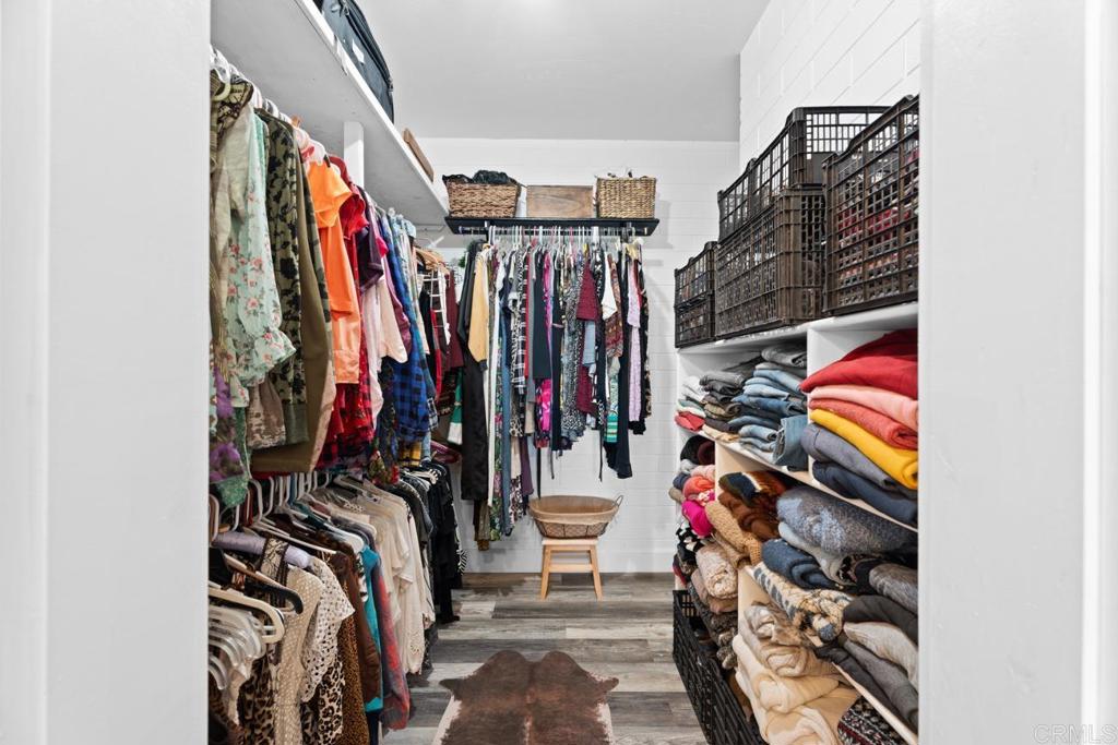 812 Sharon Way El Cajon, CA 92020 - Photo 27 of 65 a view of walk in closet with clothes
