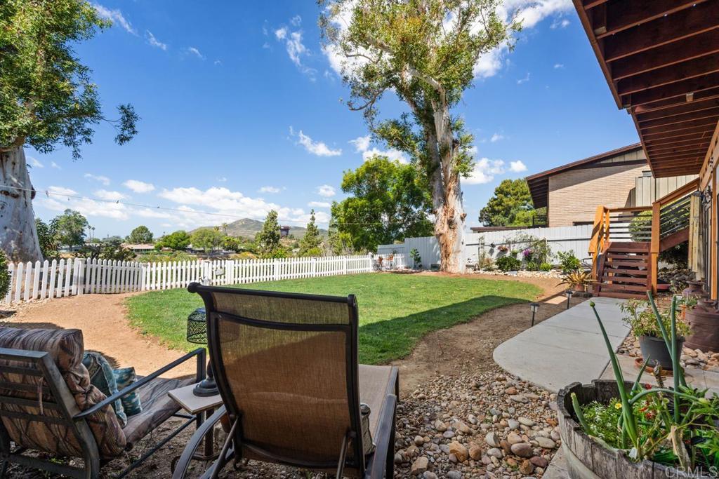 812 Sharon Way El Cajon, CA 92020 - Photo 42 of 65 a view of a patio with couches table and chairs and potted plants