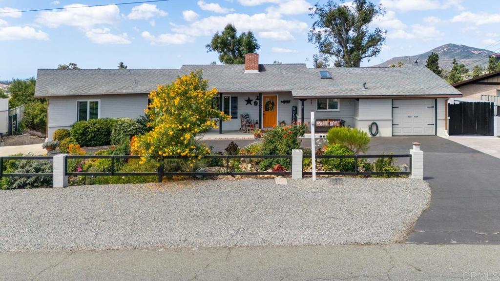 812 Sharon Way El Cajon, CA 92020 - Photo 49 of 65 front view of a house with a yard and potted plants