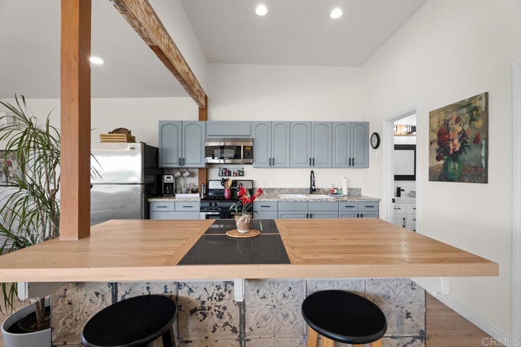812 Sharon Way El Cajon, CA 92020 - Photo 60 of 65 a kitchen with stainless steel appliances granite countertop a sink stove and refrigerator