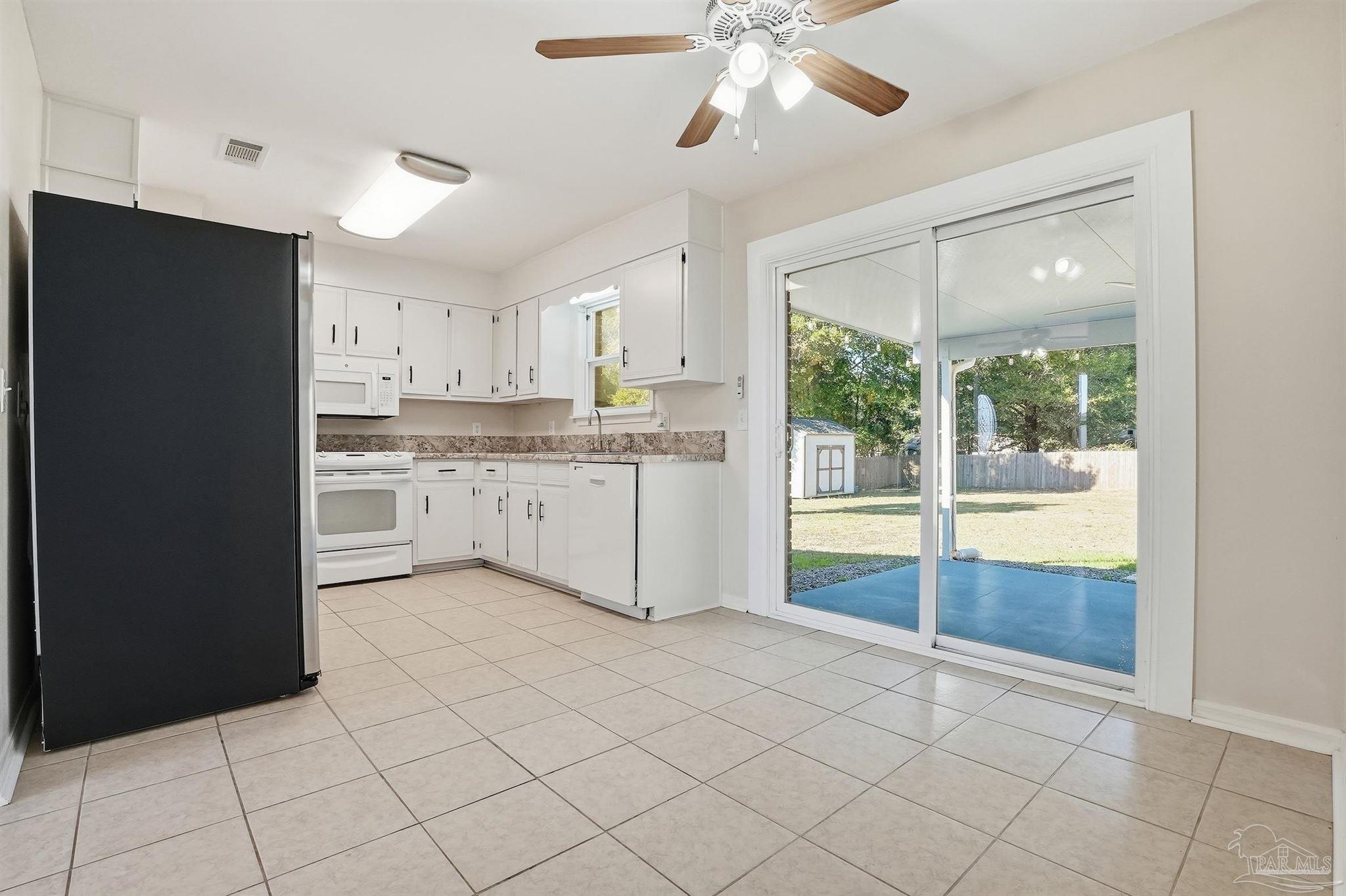 5590 Cyanamid Road Milton, FL 32583 - Photo 11 of 44 a kitchen with stainless steel appliances granite countertop a refrigerator and a sink